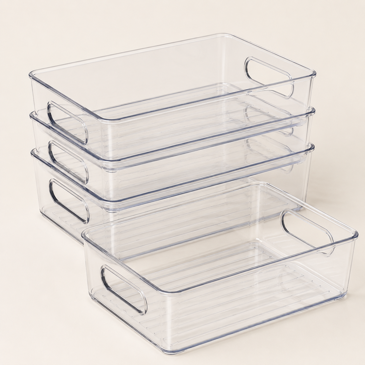 Four clear stackable refrigerator organiser bins
